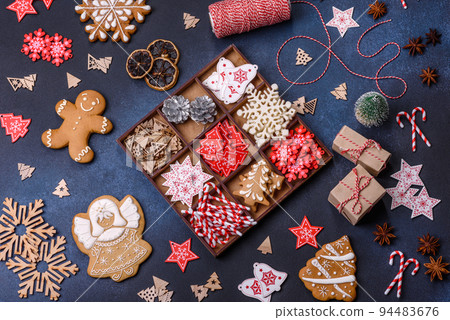 Christmas composition with gingerbread cookies, Christmas toys, pine cones and spices 94483676