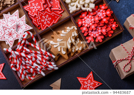Christmas composition with gingerbread cookies, Christmas toys, pine cones and spices 94483687