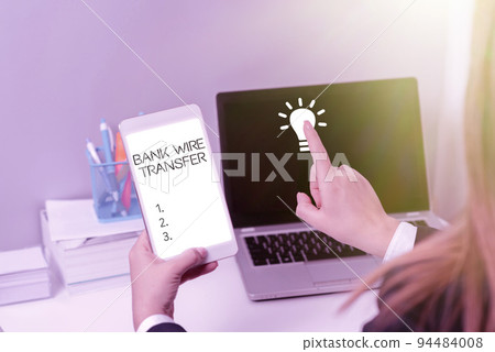 Text caption presenting Bank Wire TransferElectronic transfer of money through banks. Concept meaning Electronic transition of funds through financial instances. Text caption presenting Bank Wire TransferElectronic transfer of money through banks. Concept meaning Electronic transition of funds through financial instances. 94484008