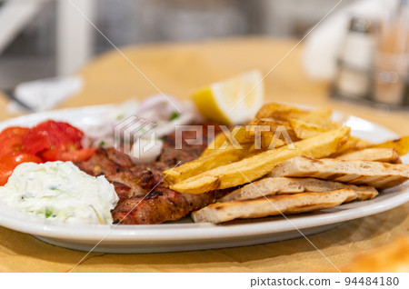 Fried meat souvlaki, Greek restaurant 94484180