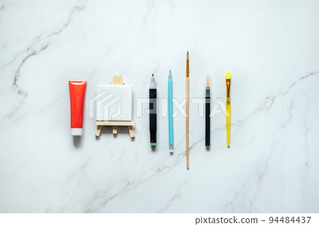 Drawing painting class. Colorful paints, brushes, stationery, supplies for drawing and craft. Creative education setting, artist desk top view, flat lay, copy space Drawing painting class. Colorful paints, brushes, stationery, supplies for drawing and craft. Creative education setting, artist desk top view, flat lay, copy space 94484437