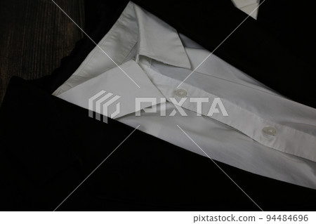 Classic tailcoat suit. White shirt, white bow tie and black jacket. Suit for ballroom dancing. Wedding accessories 94484696