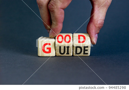 Good guide symbol. Concept words Good guide on wooden cubes. Businessman hand. Beautiful grey table grey background. Good guide and business concept. Copy space. Good guide symbol. Concept words Good guide on wooden cubes. Businessman hand. Beautiful grey table grey background. Good guide and business concept. Copy space. 94485298