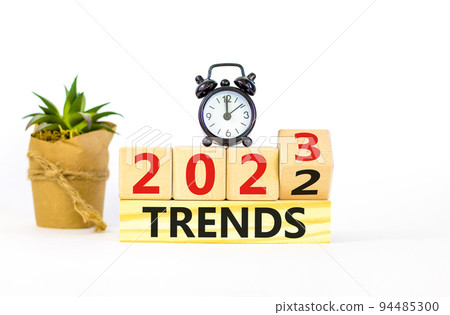 2023 trends new year symbol. Turned wooden cube and changes words Trends 2022 to Trends 2023. Beautiful white table white background, copy space. Business 2023 trends new year concept. 2023 trends new year symbol. Turned wooden cube and changes words Trends 2022 to Trends 2023. Beautiful white table white background, copy space. Business 2023 trends new year concept. 94485300