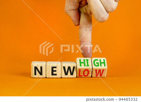 New low or high symbol. Concept words New high and New low on wooden cubes. Businessman hand. Beautiful orange table orange background. Business new low or high concept. Copy space. New low or high symbol. Concept words New high and New low on wooden cubes. Businessman hand. Beautiful orange table orange background. Business new low or high concept. Copy space. 94485332