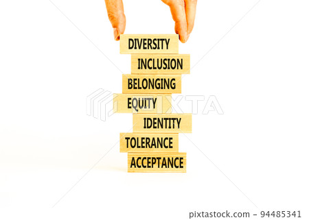 Diversity, inclusion symbol. Diversity belonging inclusion equity identity tolerance acceptance words on blocks. Businessman hand. Beautiful white background. Diversity inclusion belonging concept. Diversity, inclusion symbol. Diversity belonging inclusion equity identity tolerance acceptance words on blocks. Businessman hand. Beautiful white background. Diversity inclusion belonging concept. 94485341