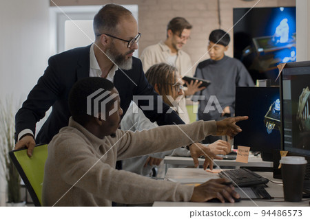 CEO of company studio developers of games discusses with the artist 3D model 94486573
