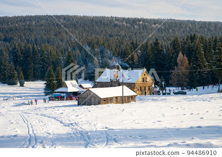 Historical mountain village on sunny winter day 94486910
