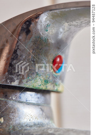 Rusted faucet, macro shot of rusted faucet. Water scarcity and water consumption concept idea. 94487128