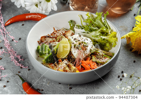 Healthy bowl - quinoa salad with tuna, broccoli, avocado on wooden rustic table. top view 94487304
