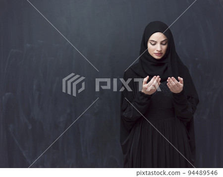 Portrait of young Muslim woman making dua Portrait of young Muslim woman making dua 94489546