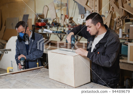 Workers Building Wooden Furniture 94489679