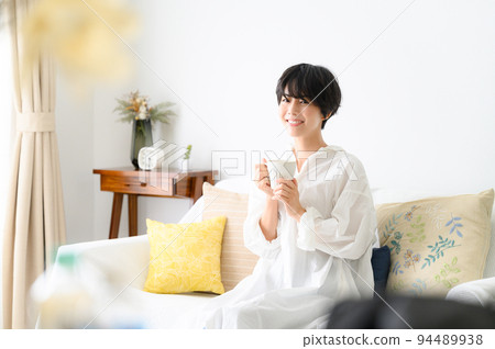 A woman relaxing in the room 94489938
