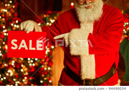 Santa Claus Holding Sale Sign Close Up Santa Claus Holding Sale Sign Close Up 94490034
