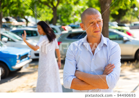 couple having a quarrel outside 94490693