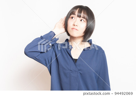 young woman listening to gossip 94492069
