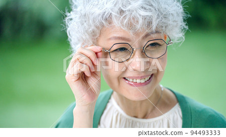 Smiling senior woman (elderly, glasses, reading glasses) Smiling senior woman (elderly, glasses, reading glasses) 94493333
