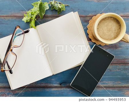 Open book, coffee, smartphone and glasses_bird's-eye view Open book, coffee, smartphone and glasses_bird's-eye view 94493953