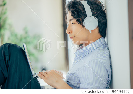 Men with headphones Men with headphones 94494102