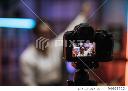 View of video camera screen with attractive confident african american skilled business woman View of video camera screen with attractive confident african american skilled business woman 94495212