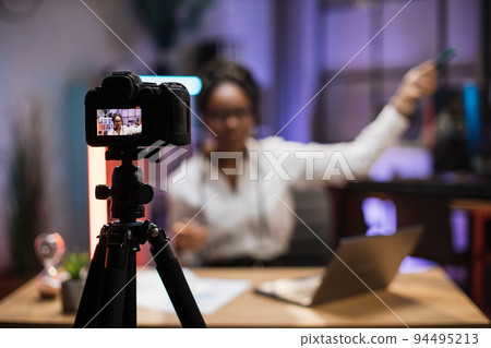 View of video camera screen with attractive confident african american skilled business woman 94495213