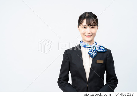A woman in a suit with a blue scarf A woman in a suit with a blue scarf 94495238