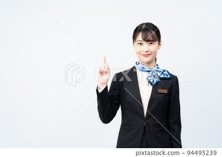 A woman in a suit with a blue scarf (pointing pose) A woman in a suit with a blue scarf (pointing pose) 94495239