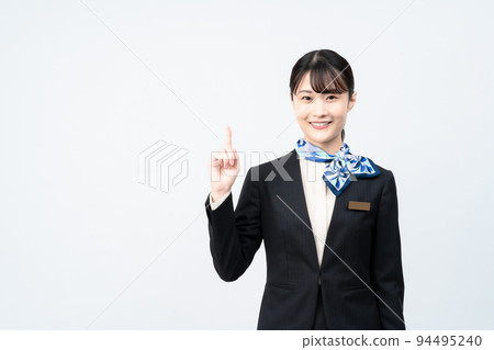 A woman in a suit with a blue scarf (pointing pose) A woman in a suit with a blue scarf (pointing pose) 94495240