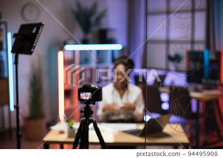 Focus on glass board with graphs and charts of export and female trader or office worker Focus on glass board with graphs and charts of export and female trader or office worker 94495908