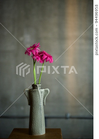 Vase and gerberas on the table 94496958