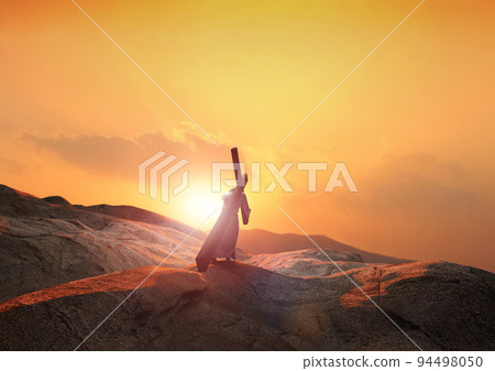 The example of carrying the cross of suffering that symbolizes the light and clouds of the hill at sunset and death, sacrifice, and resurrection The example of carrying the cross of suffering that symbolizes the light and clouds of the hill at sunset and death, sacrifice, and resurrection 94498050