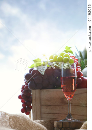 Fresh grapes and wine from the vineyard in boxes and red wine 94498056
