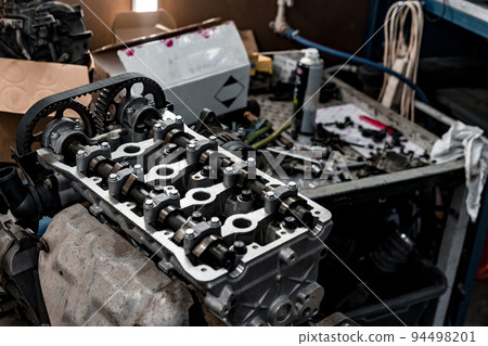 Disassembled car engine block at car service station Disassembled car engine block at car service station 94498201