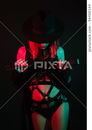 sexy woman in beautiful underwear in a hat holds a leather whip flogger for BDSM sex sexy woman in beautiful underwear in a hat holds a leather whip flogger for BDSM sex 94498344