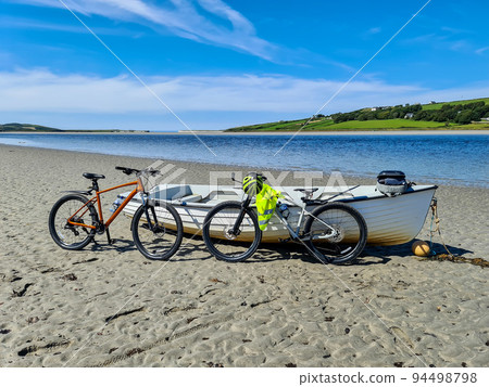 Concept of enjoying the outdoors by bicycle and boat at Gweebarra Bay , County Donegal - Ireland Concept of enjoying the outdoors by bicycle and boat at Gweebarra Bay , County Donegal - Ireland 94498798