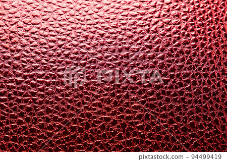 Texture of red leather close-up top view 94499419