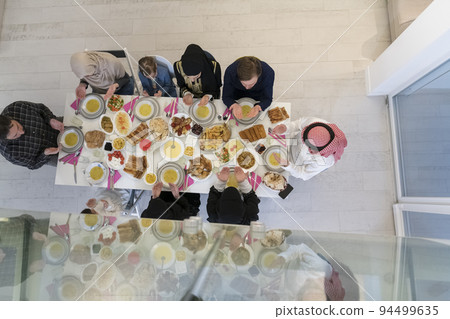Top view of muslim family having Iftar during Ramadan holy month 94499635