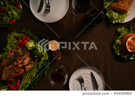 Traditional Thanksgiving dinner meal with roasted turkey and all sides dishes on wooden table. Traditional autumn food concept 94499960