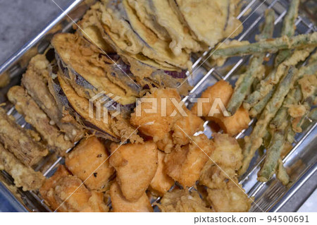 Freshly fried tempura on the vat Freshly fried tempura on the vat 94500691