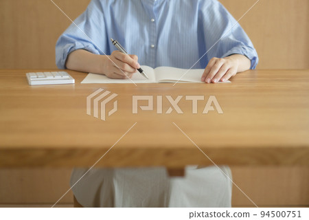 Woman using calculator at home. Household budget, payments, payments, budgets, loans, calculations, etc. Woman using calculator at home. Household budget, payments, payments, budgets, loans, calculations, etc. 94500751