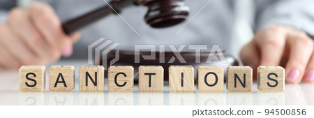 International sanctions and judge with gavel in courtroom 94500856