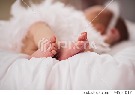 Newborn baby feet on light background 94501017