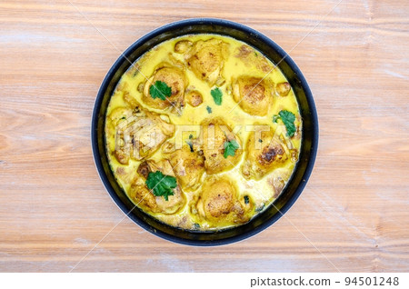 Fresh chicken tikka masala freshly cooked in a home kitchen close-up. Fresh chicken tikka masala freshly cooked in a home kitchen close-up. 94501248