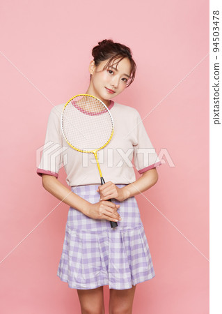 Pink background portrait of young woman in sporty fashion Pink background portrait of young woman in sporty fashion 94503478