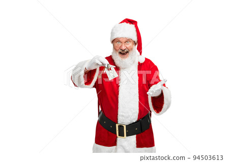 Portrait of senior man in image of Santa Claus with new apartment keys isolated over white background 94503613