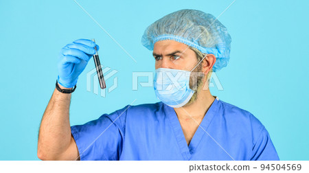 epidemy health danger. doctor in respirator mask. nurse look at test tube with blood. coronavirus from china. pathogen infected. minimize risk of spread disease. Samples taken by doctor from patient 94504569
