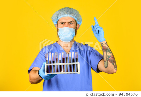 man doctor in mask hold tubes for test. Chinese virus infection risks. disease control and prevention. outbreak of new coronavirus. first signs of virus. virus transmission method. incubation period 94504570