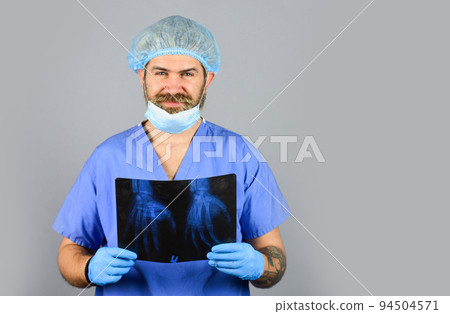 Radiologist hold xray. doctor examines radiographical snapshot. x-raying of hands. nurse checking x-ray film at hospital. health problems. Surgery operation and medical concept. man look at roentgen 94504571