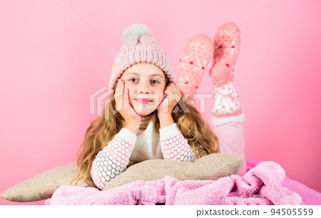 Kid dreamy face wear knitted accessory. Kid girl wear cute knitted fashionable hat and scarf accessory. Winter fashion accessory. Winter accessory concept. Girl long hair dream pink background Kid dreamy face wear knitted accessory. Kid girl wear cute knitted fashionable hat and scarf accessory. Winter fashion accessory. Winter accessory concept. Girl long hair dream pink background 94505559