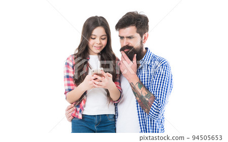 Family of bearded man and girl child text message on mobile phone, sms Family of bearded man and girl child text message on mobile phone, sms 94505653